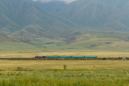 passenger train in the mountains on the border with Kazakhstan, Chinaの写真素材
