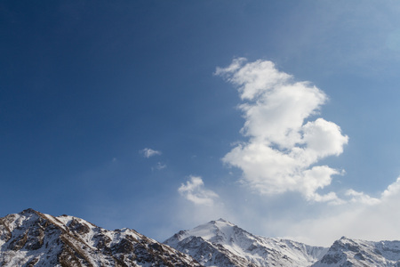 clouds over the tops of the mountains of Kazakhstan