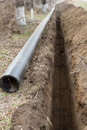 deep trench for laying a new water pipeの写真素材