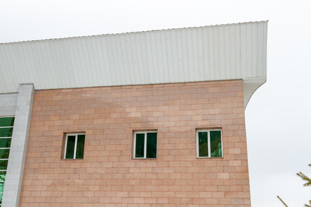 tinted windows on the facade of the buildingの写真素材