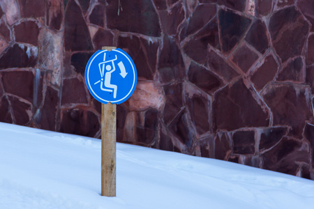 sign on chairlift nailed to a wooden poleの写真素材