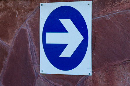 arrow pointing to the right on the wallの写真素材