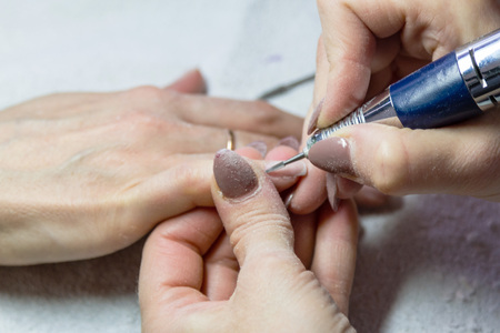 Processing of extension of nails in a beauty salon