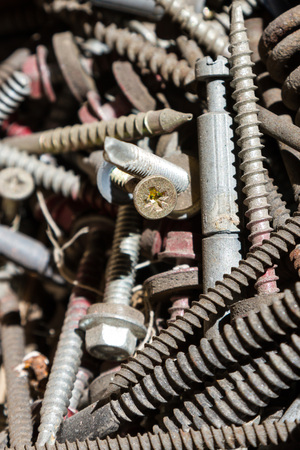 Different old screws and bolts in the heapの写真素材