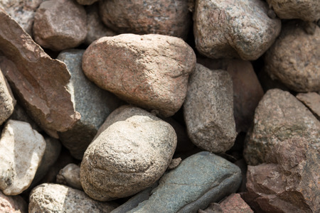 Texture of a pile of granite cobblestonesの写真素材