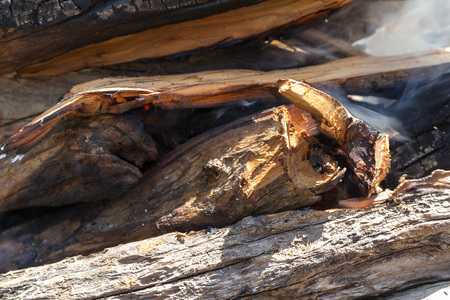 smoke from incendiary firewood in the open fireの写真素材