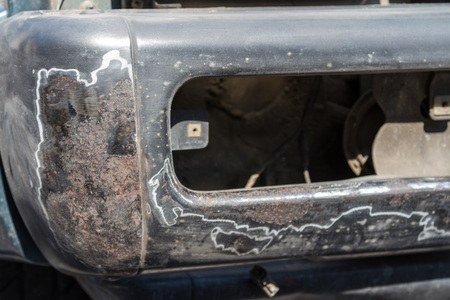 rust removal of an old metal bumper