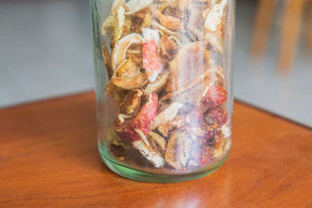 Jar of dried fruits that worms eatの写真素材