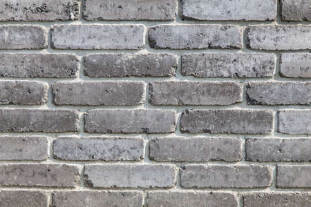dark wall made of ash color bricks
