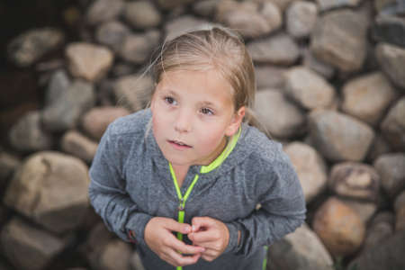 teenage girl on a rocky shore in Denmarkの写真素材