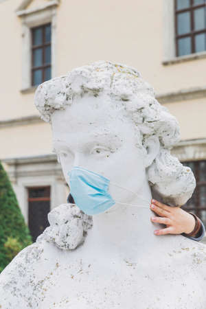 Zolochev, Ukraine, September 2020: Ancient statue of a woman in a medical maskのeditorial素材
