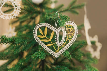 Embroidered Christmas toys in the form of a heart on the tree