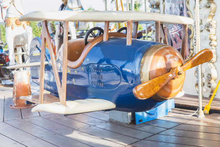 toy plane on a beautiful carousel in an amusement park in Ukraineの写真素材