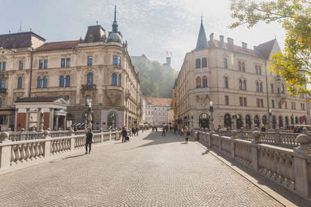Ljubljana, Slovenia, October 2020: panorama picture of the Triple Bridge overlooking the Ljubljana Castle.のeditorial素材