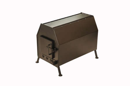 Metal wood stove for heating homes and industrial premises on white background. Interior elementの写真素材