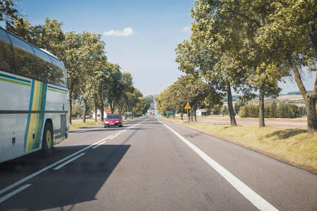 Outskirts of Warsaw, Poland, August 2017: Long straight intercity road in Poland. Road landscapeのeditorial素材