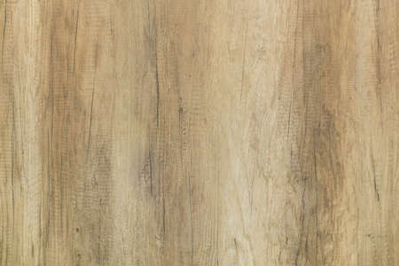 Wooden background. Brown polished wood texture with cracksの写真素材