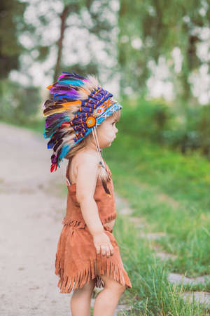 Cute baby dressed in traditional Native AmericanÑ costumeの写真素材