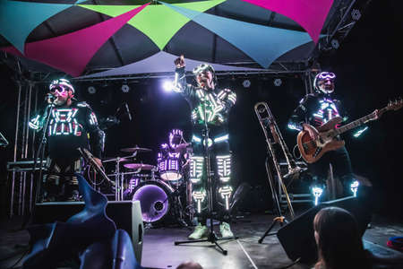 Glebovka, Ukraine, August 2020: Musicians in illuminated robotic suits on the celebration the...