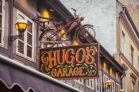 Aalborg, Denmark, October 2021: Bar with a vintage bike on the roofのeditorial素材