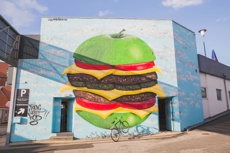 Viborg, Denmark, July 2018: Huge apple hamburger painted on the houseのeditorial素材