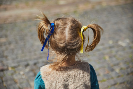 charming child with Ukrainian ribbons in her hairの写真素材