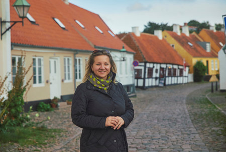 Beautiful woman walking in evening Ebeltoft Denmark