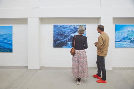 Skagen, Denmark, May, 2023: Visitors look at the paintings in gallery