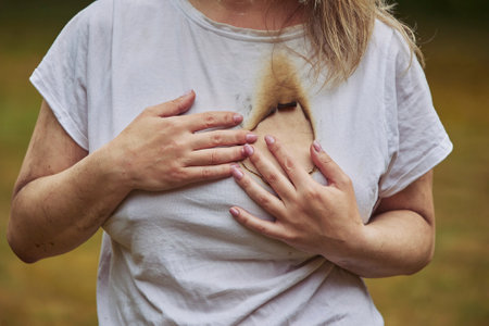 woman with a burnt hole in her heartの写真素材