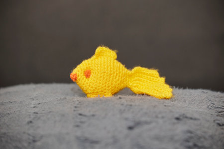 Cute toy knitted fish in the nurseryの写真素材