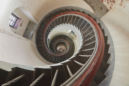 Spiral staircase inside an ancient lighthouse in Denmarkの写真素材