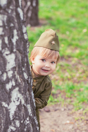 Adorable baby girl in Soviet military uniformの写真素材