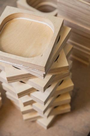 wooden bases Audio Speakers stacked like a tower at the factoryの写真素材