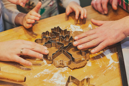 A family with children makes cookies. Close-up