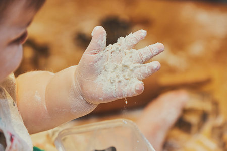 Little child making cookies at home. Close-upの写真素材