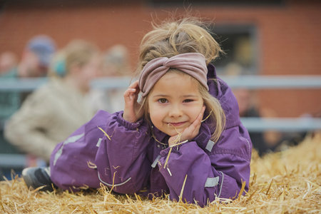 Charming child on a cows farm in Denmark