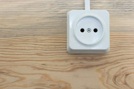 White overhead socket on wooden background close upの写真素材
