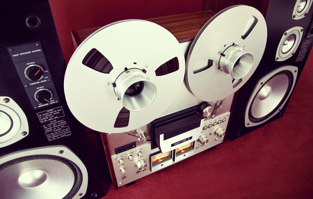 Analog Stereo Open Reel Tape Deck Recorder Vintage with Speakers Closeup