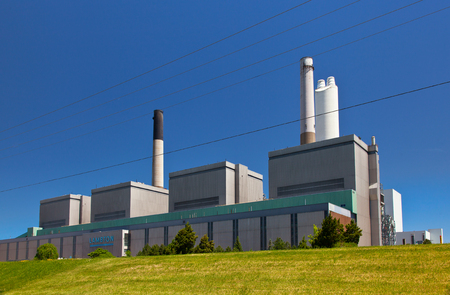 Coal fueled electricity power plant generation station building with smokestack perspective viewのeditorial素材