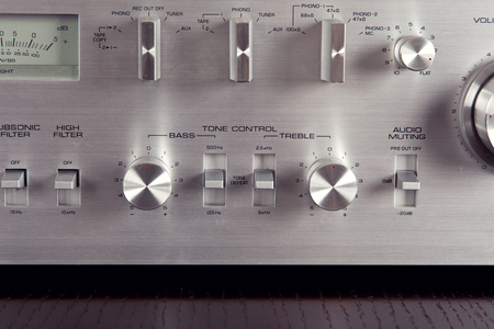 Vintage Stereo Amplifier Frontal Metal Panel with Tone Contril Knobs Closeup