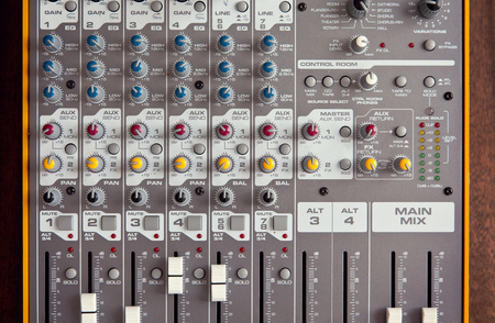 Audio studio sound mixer equalizer board controls faders sliders knobs, top view closeupの写真素材