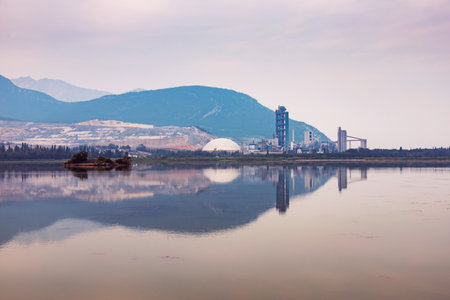 Cement Plant on the Lac des Arcs Lake Shore, Surreal Morning Scenic Lookout viewpoint, Exshaw, Alberta, Canadaの写真素材