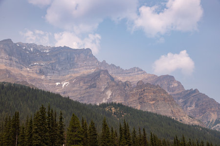 Canadian Rocky Mountains with Summer Day Haze, Banff National Park, Alberta, Canada, look from the groundの写真素材