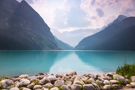 Lake Louise Turquoise Water Mirror Surface with Canadian Rocky Mountains Behind, Summer Day Haze, Banff National Park, Alberta, Canada, surrela landscapeの写真素材