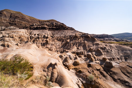 Surreal Badlands Sandstone Formations near Drumheller, Dinosaur capital of the world. Land of hoodoos, multi-hued canyons and geological erosion sculptured by water and windの写真素材