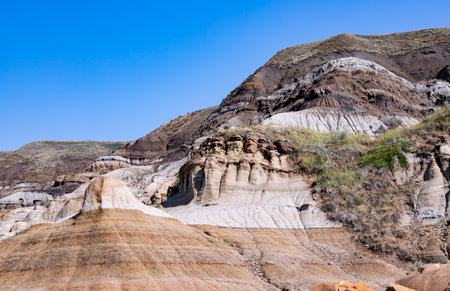 Badlands near Drumheller, Dinosaur capital of the world. One of Canada's most unique landscapes: land of hoodoos, multi-hued canyons and land formations sculptured by water and windの写真素材