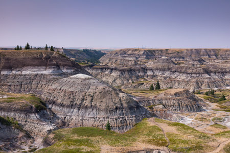 Badlands near Drumheller, Dinosaur capital of the world. One of Canada's most unique landscapes: land of hoodoos, multi-hued canyons and land formations sculptured by water and windの写真素材