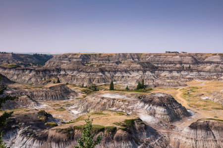 Badlands near Drumheller, Dinosaur capital of the world. One of Canada's most unique landscapes: land of hoodoos, multi-hued canyons and land formations sculptured by water and windの写真素材