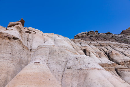 Surreal Badlands Sandstone Formations near Drumheller, Dinosaur capital of the world. Land of hoodoos, multi-hued canyons and geological erosion sculptured by water and windの写真素材