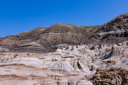 Surreal Badlands Sandstone Formations near Drumheller, Dinosaur capital of the world. Land of hoodoos, multi-hued canyons and geological erosion sculptured by water and windの写真素材